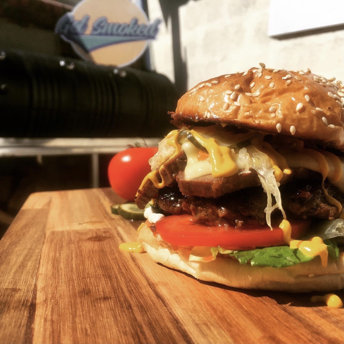 Succulent Ruben burger with smoked trimings.